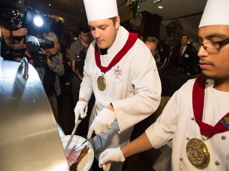 Stanford's Brendon Austin carves prime rib at the Lawry's Beef Bowl