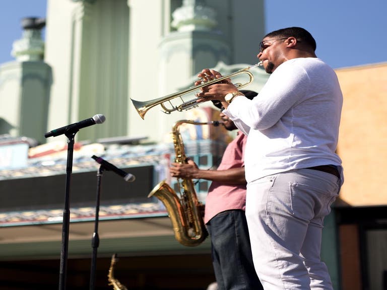 Supa Lowery Brothers perform outside the Vision Theatre in Leimert Park