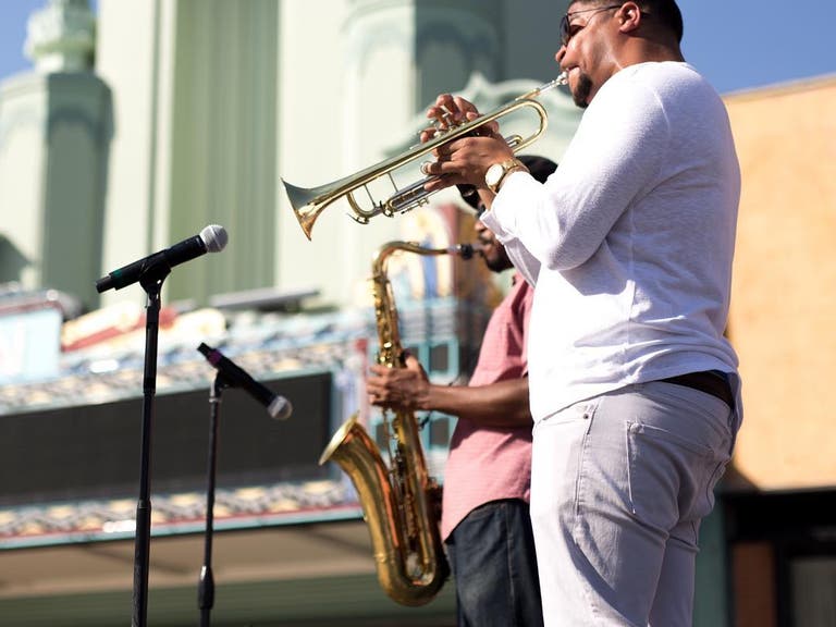 Supa Lowery Brothers perform outside the Vision Theatre in Leimert Park