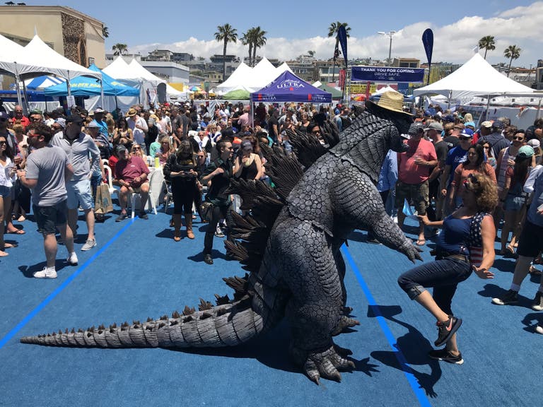 Godzilla dancing at Fiesta Hermosa