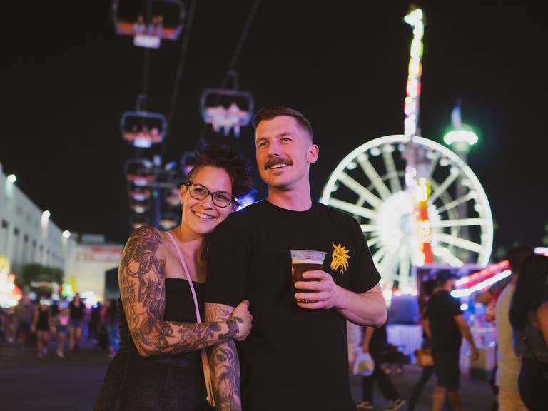 Couple in the Fun Zone at the LA County Fair at night