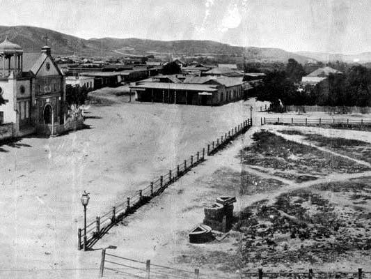 Panoramic view of Los Angeles Plaza and Old Plaza Church in 1869
