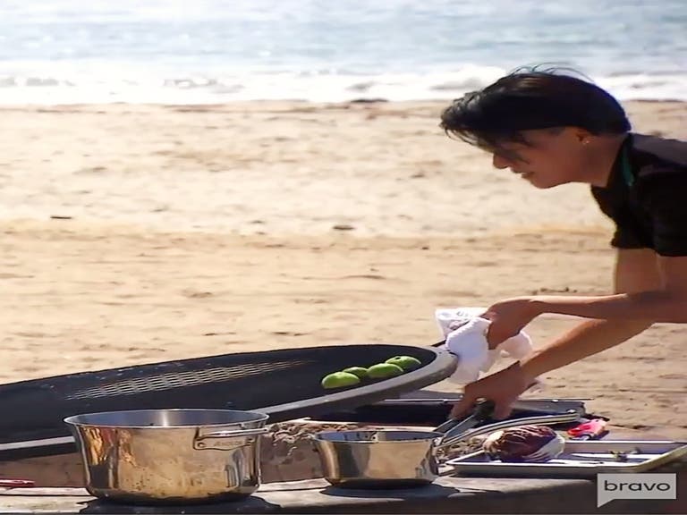 Chef Melissa King grills radicchio in a fire pit at Cabrillo Beach