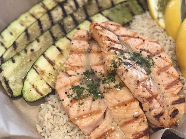 Garlic butter salmon at Crazy Fish Grill & Market | Instagram by @crazyfishgm